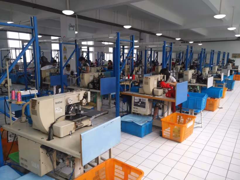 Sewing machine workstations in the HappyPet Crafts production workshop